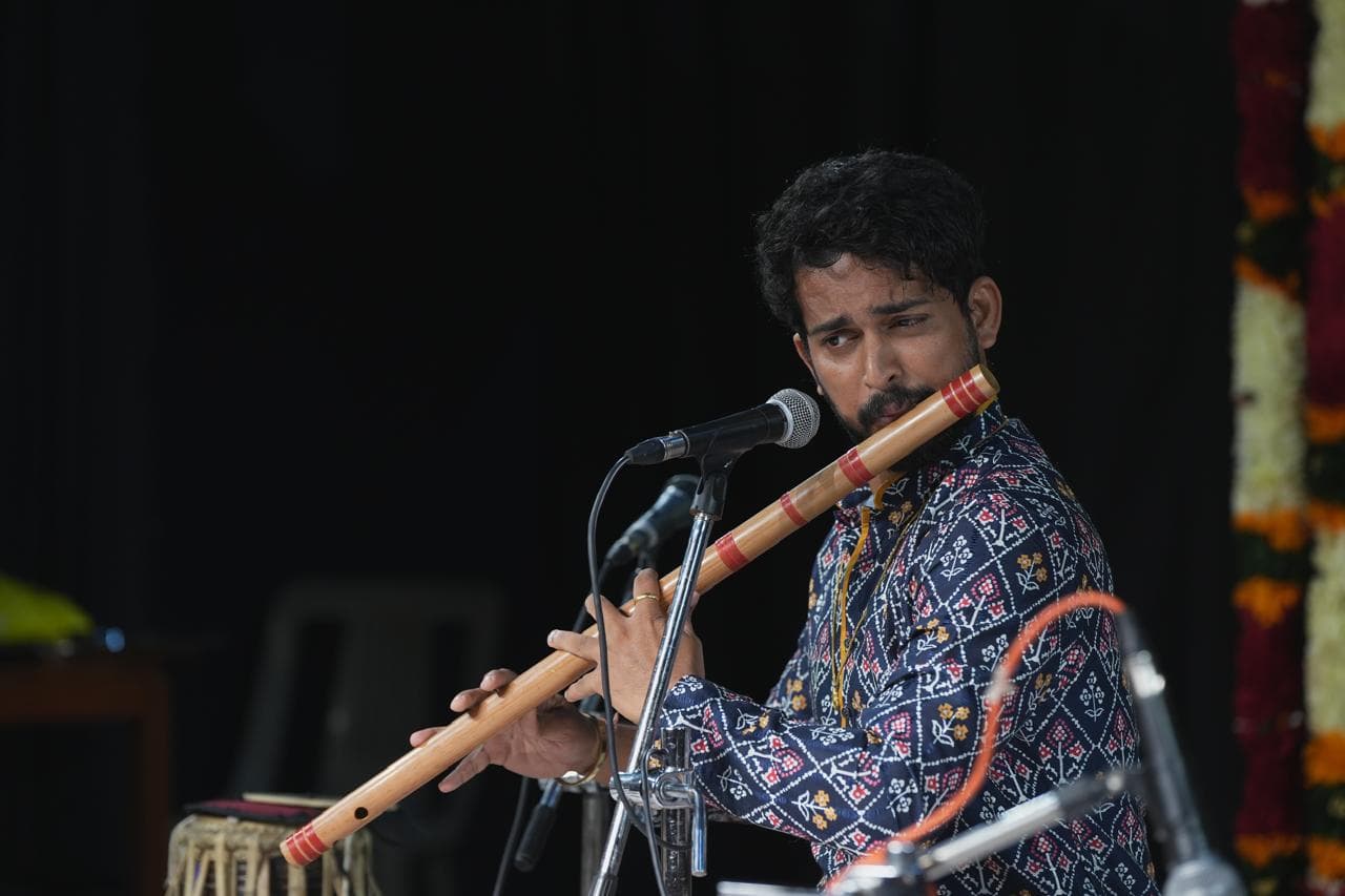 Ayushman performing on the bansuri